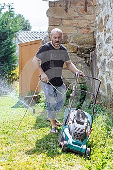 Yound Man Mowing the lawn