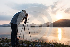 Yound man taking camera