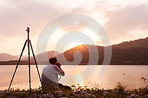 Yound man taking camera