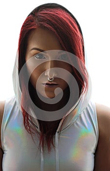 The yound redhead woman in the holographic top with hood