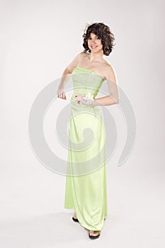 Yound smiling girl in long green dress