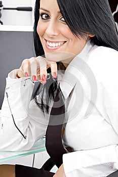 Young accountant holding eyewear