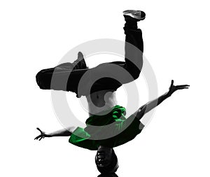 Young acrobatic break dancer breakdancing man silhouette