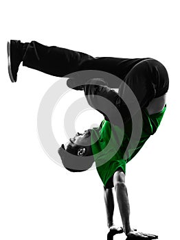 Young acrobatic break dancer breakdancing man silhouette