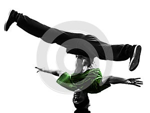 Young acrobatic break dancer breakdancing man silhouette