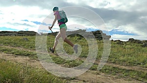 Young active female run outdoor in the sunny summer.