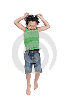 A Young Active Happy Boy Jumping in The Air