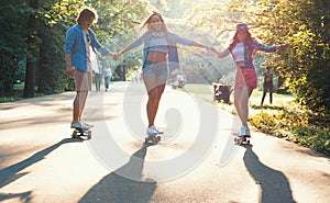 Young active skaters outdoors photo