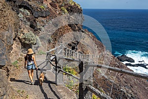 Young active woman walks on the path