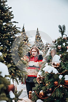 Young and adorable russian girl walking on Manezhnaya Square Moscow on the Red Square through winter holiday