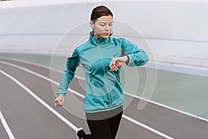 Young adult athletic woman  running on sport training in city