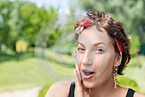 Young adult beautiful happy attractive caucasian brunette woman portrait have fun enjoy excited telling whisper secret