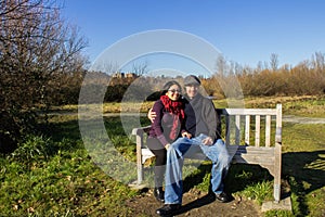 Young adult couple having winter fun in park