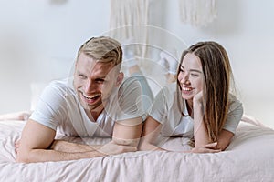 Young adult family spending morning in bedroom