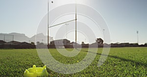 Young adult female rugby player on a rugby pitch