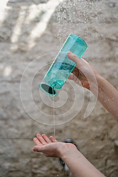 Young adult girl standing in bright bathroom