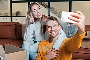 Young adult girlfriend and boyfriend move in new house together