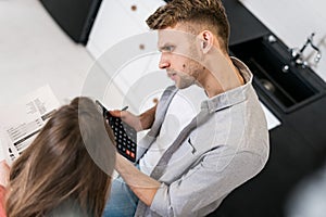 Young adult girlfriend and boyfriend spending morning in kitchen