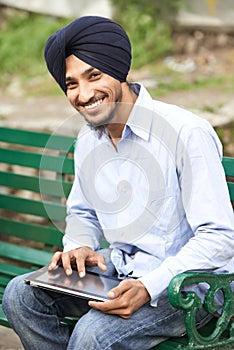 Young adult indian sikh man photo