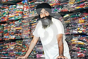Young adult indian sikh seller man photo