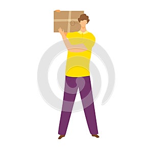 Young adult male holding a cardboard box on his shoulder. Casual clothing, delivery service concept. Move box, courier