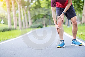 Young adult male with muscle pain during running. runner have knee ache due to Runners Knee or Patellofemoral Pain Syndrome,