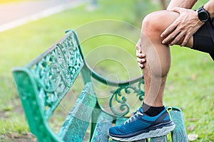 Young adult male with muscle pain during running. runner have knee ache due to Runners Knee or Patellofemoral Pain Syndrome,