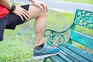 Young adult male with muscle pain during running. runner have knee ache due to Runners Knee or Patellofemoral Pain Syndrome,