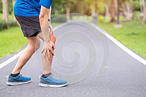 Young adult male with muscle pain during running. runner have knee ache due to Runners Knee or Patellofemoral Pain Syndrome,