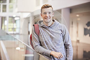 Young adult male student in the lobby of a university