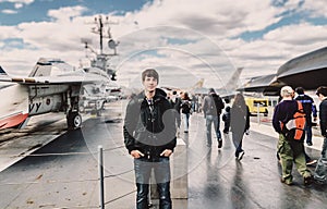 Young adult man at the intrepid museum new york