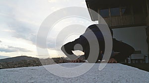 Young adult man praying outdoor, Prostration pose.