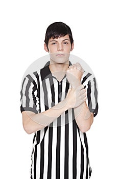 Young adult man in referee uniform holding penalty