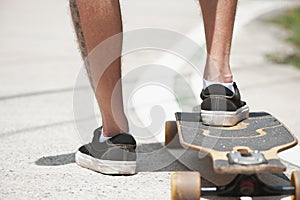 Young adult man with skate board on the road