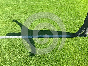 Young adult man walking on imaginative white line