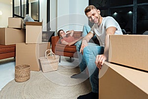Young adult man and woman move in new flat together