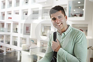 Young adult Middle Eastern male student smiling to camera