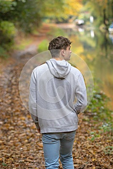 Young adult walking outside