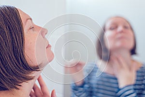 Young adult woman applying anti-aging cream