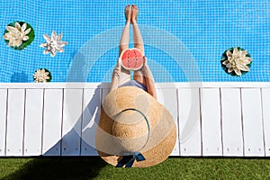 Young adult woman female relaxing on resort near pool in summer