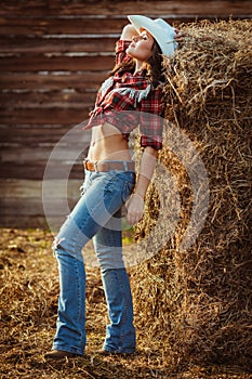 Young adult woman posing on farmland