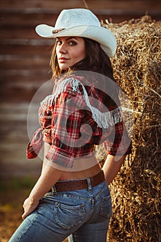 Young adult woman posing on farmland