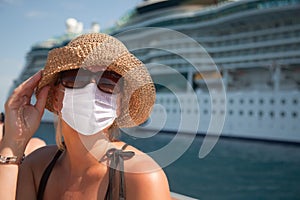 Young Adult Woman Wearing a Face Mask on Tender Boat With Passenger Cruise Ship Behind