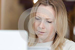 Young adult woman working on laptop