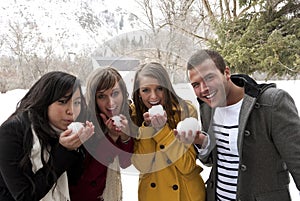 Young Adults ready for a snowball fight photo