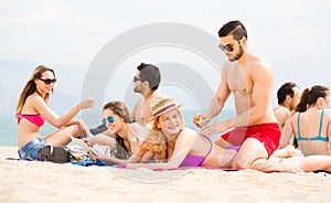 Young adults sunbathing on beach