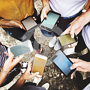 Young adults using smartphones in a circle social media and conn