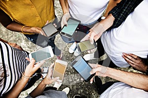 Young adults using smartphones in a circle social media and connection concept