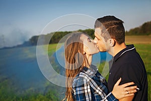 Young affectionate couple kissing tenderly