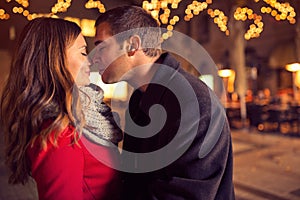 Young affectionate couple kissing tenderly photo